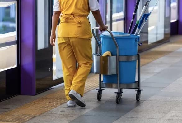 Commercial Cleaning - Lady walking with the janitorial card