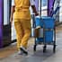 Commercial Cleaning - Lady walking with the janitorial card